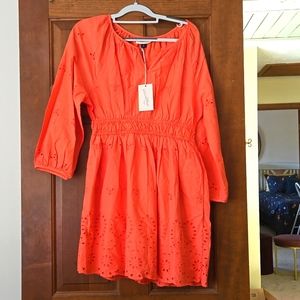 Beautiful coral color and thin flowy material. Never worn, brand new.